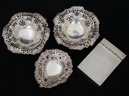 A silver cigarette packet holder and three nut dishes